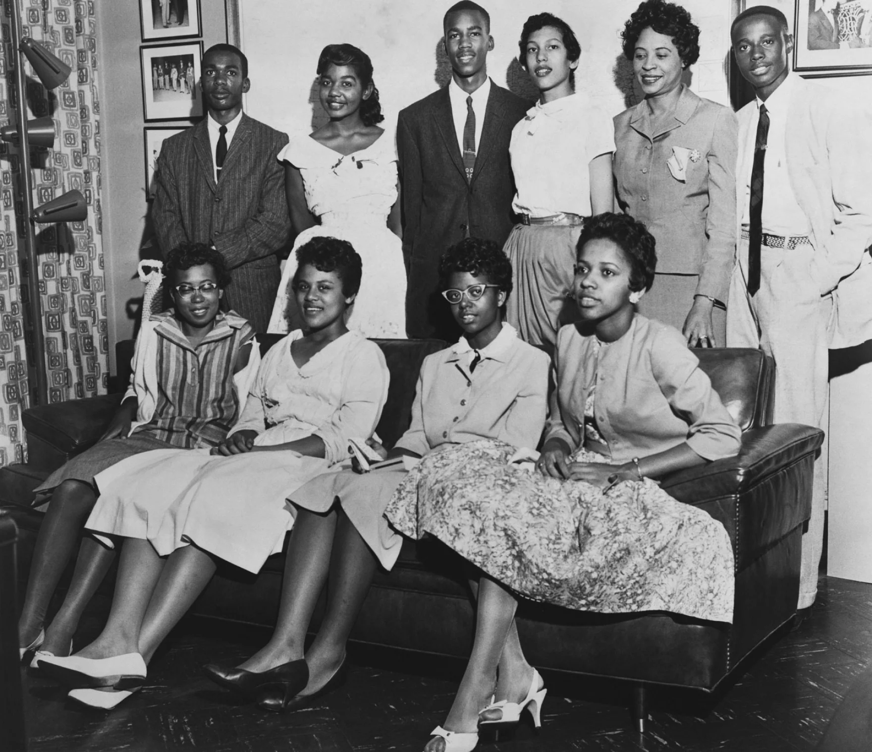 The Little Rock Nine stand with Journalist Daisy Bates (back row, second from right). (Everett Collection Historical/Alamy)
