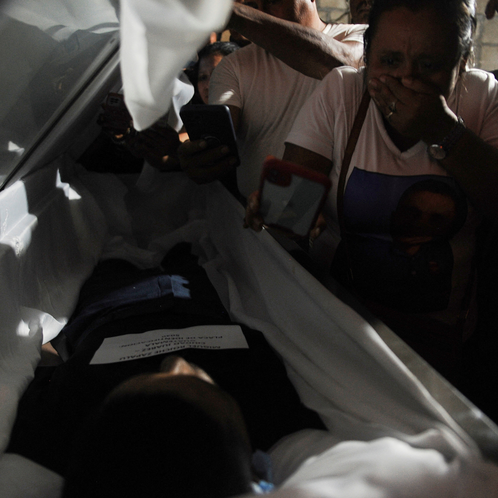 Migrant detention fire: Officials face charges and victims return home