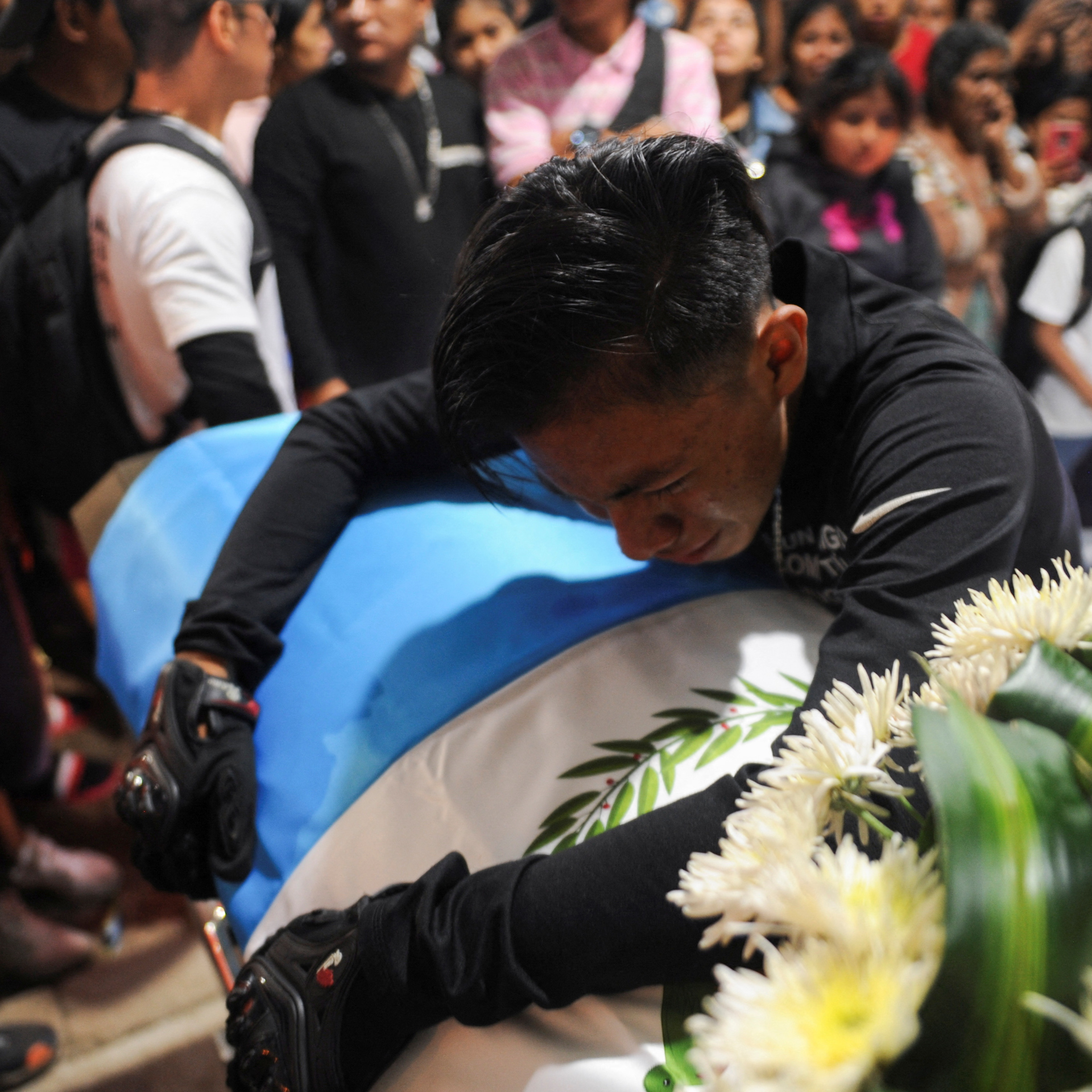 Migrant detention fire: Officials face charges and victims return home