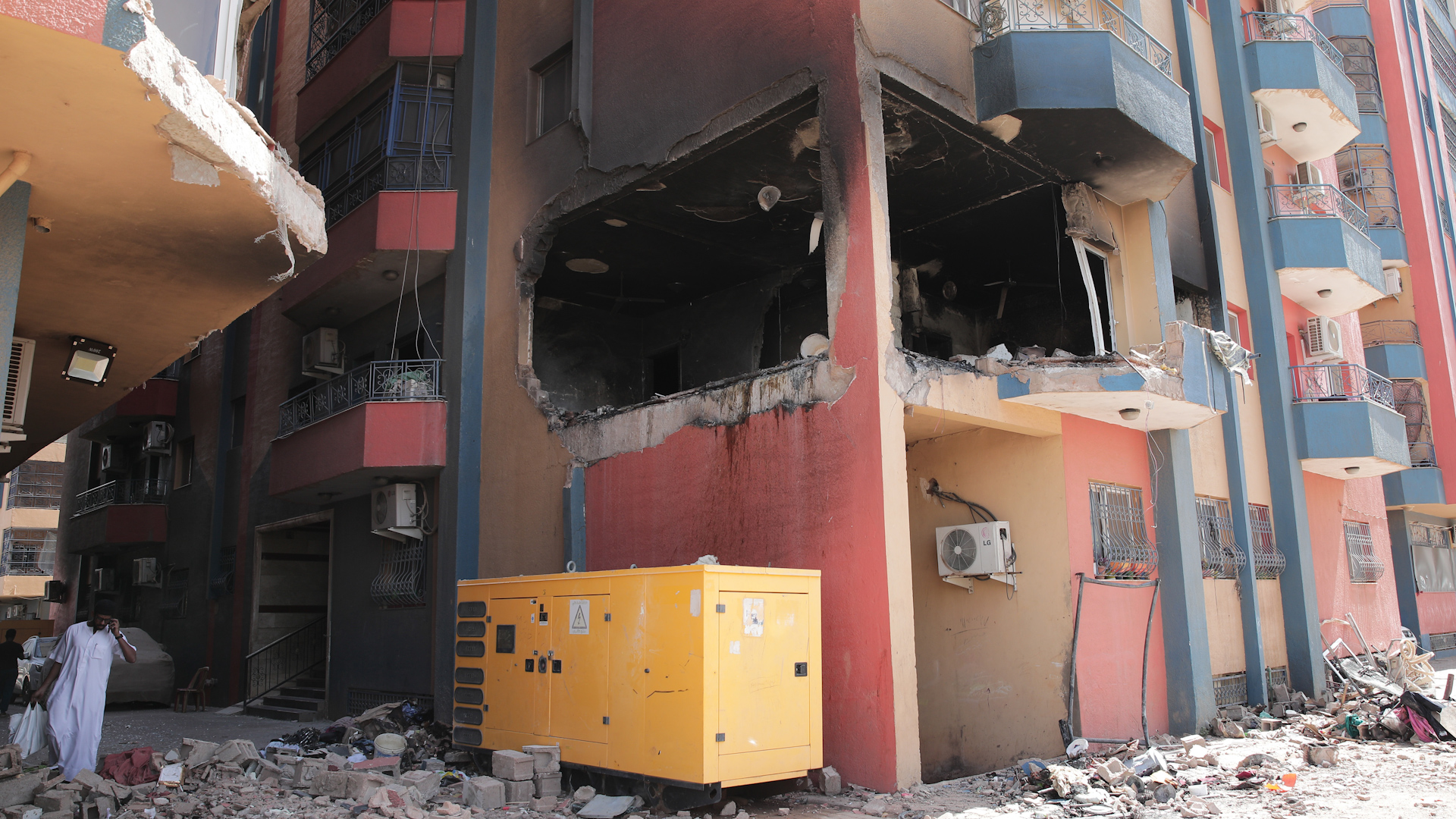 Residential buildings damaged in fighting are seen in Khartoum, Sudan, Thursday, April 20, 2023. The latest attempt at a cease-fire between the rival Sudanese forces faltered as gunfire rattled the capital of Khartoum. Through the night and into Thursday morning, gunfire could be heard almost constantly across Khartoum. (AP Photo/Marwan Ali)