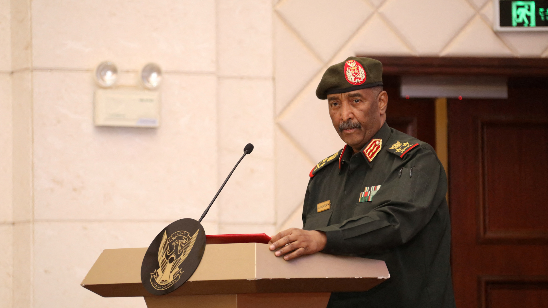Sudan's military leader General Abdel Fattah al-Burhan stands at the podium during a ceremony to sign the framework agreement between military rulers and civilian powers in Khartoum, Sudan December 5, 2022. REUTERS/El Tayeb Siddig/File Photo