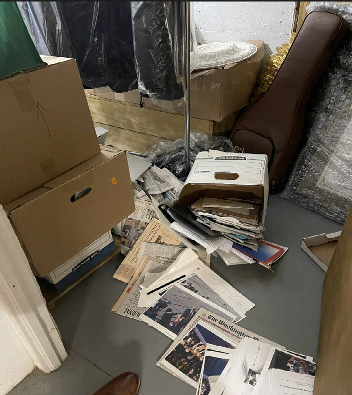 A photo published by the U.S. Justice Department in their charging document against former U.S. President Donald Trump shows a box of documents, including one classified document, spilled onto the floor in a storeroom at Trump's Mar-a-Lago club in Florida in early 2021 as seen embedded in the document released by the Justice Department in Washington, U.S. June 9, 2023. The Justice Department said they redacted the image, which they said was taken by Trump's fellow defendant and employee Walt Nauta, to obscure secret information that was visible in the image.