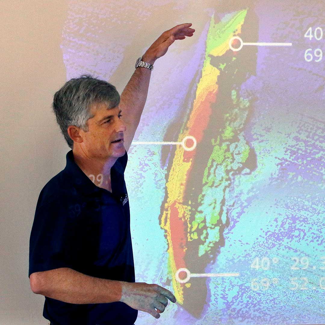 OceanGate CEO and co-founder Stockton Rush speaks in front of a projected image of the wreckage of the ocean liner SS Andrea Doria during a presentation on their findings after an undersea exploration, on June 13, 2016, in Boston.  (AP Photo/Bill Sikes, File)