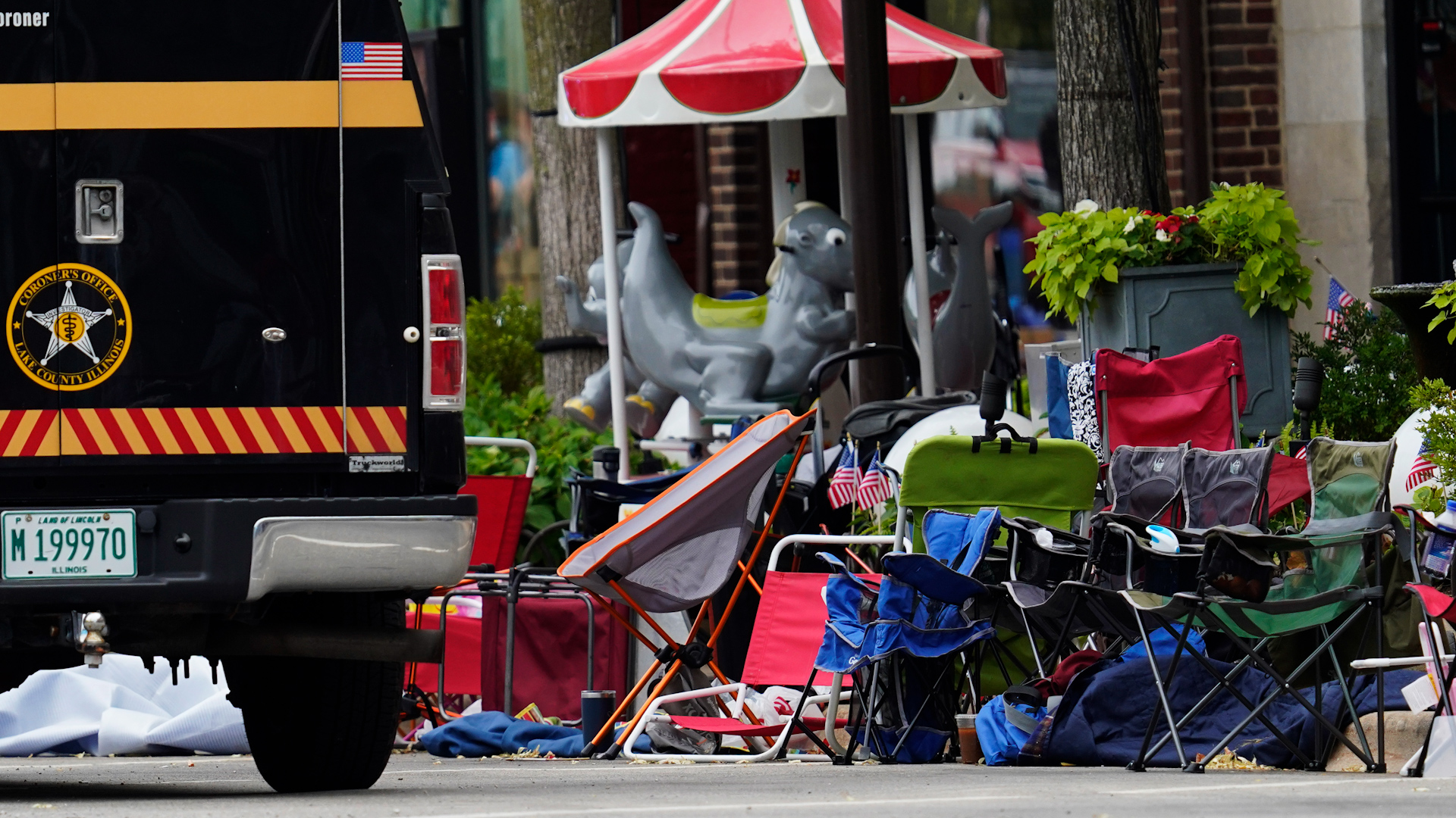 Empty chairs are seen on the street after a mass shooting at the Highland Park Fourth of July parade in downtown Highland Park, Ill., a Chicago suburb on Monday, July 4, 2022.