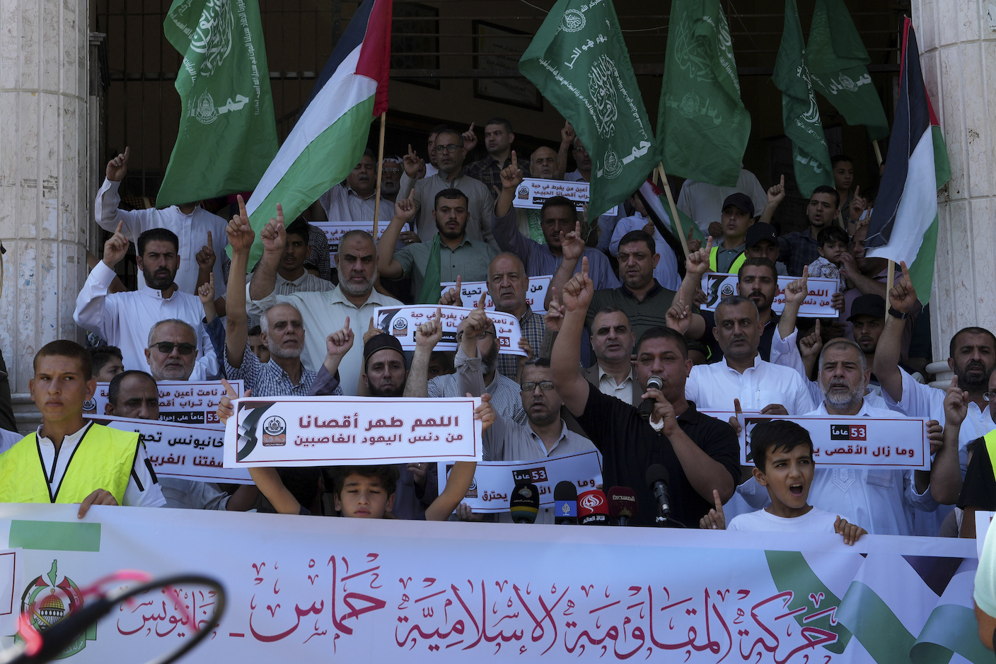 FILE - Hamas supporters wave their green Islamic flags Friday, Aug. 25, 2023. The Arabic reads 