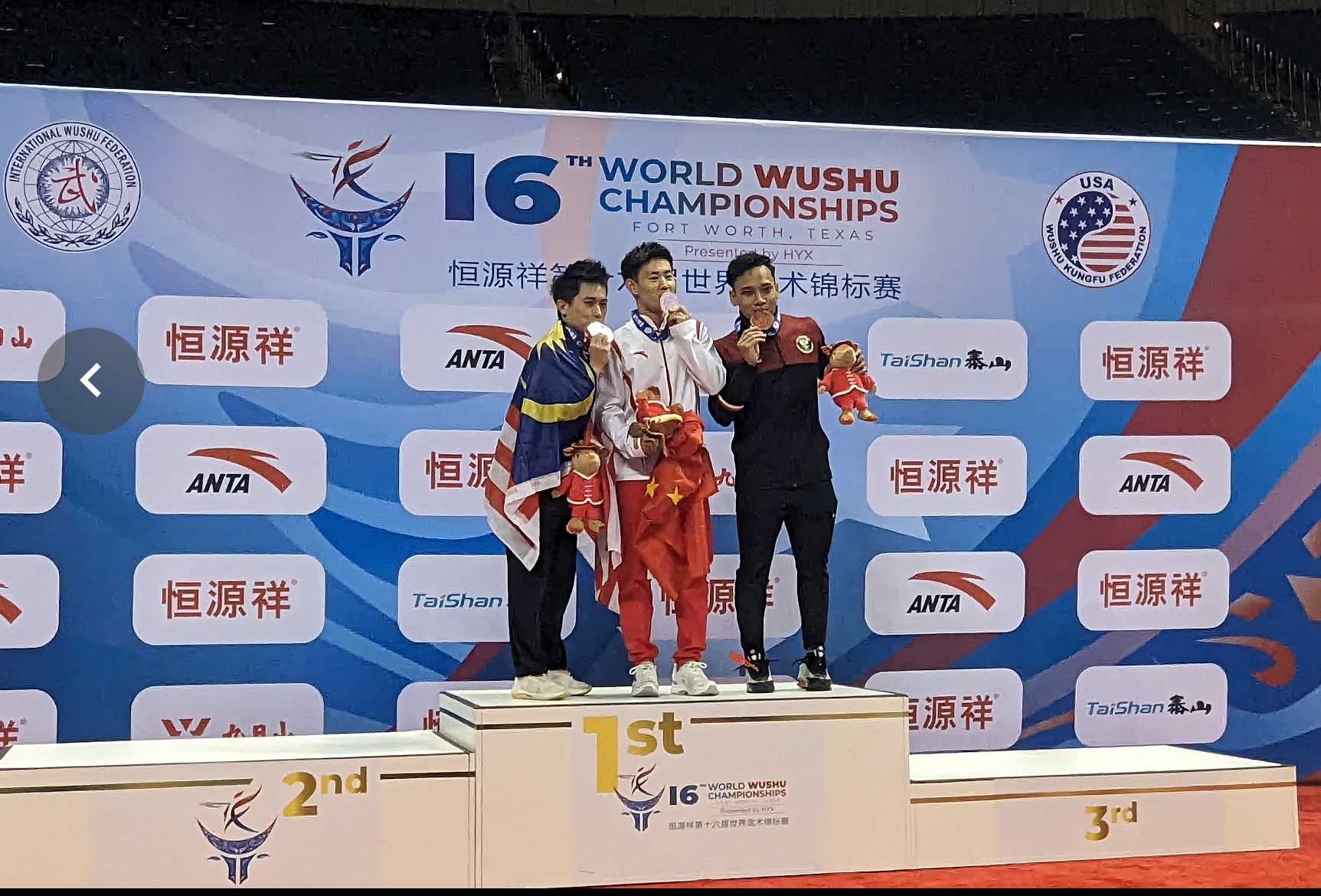 Zhang Qingchun tastes success after winning gold in men’s Qiangshu at the World Wushu Championships in Ft. Worth, Texas.