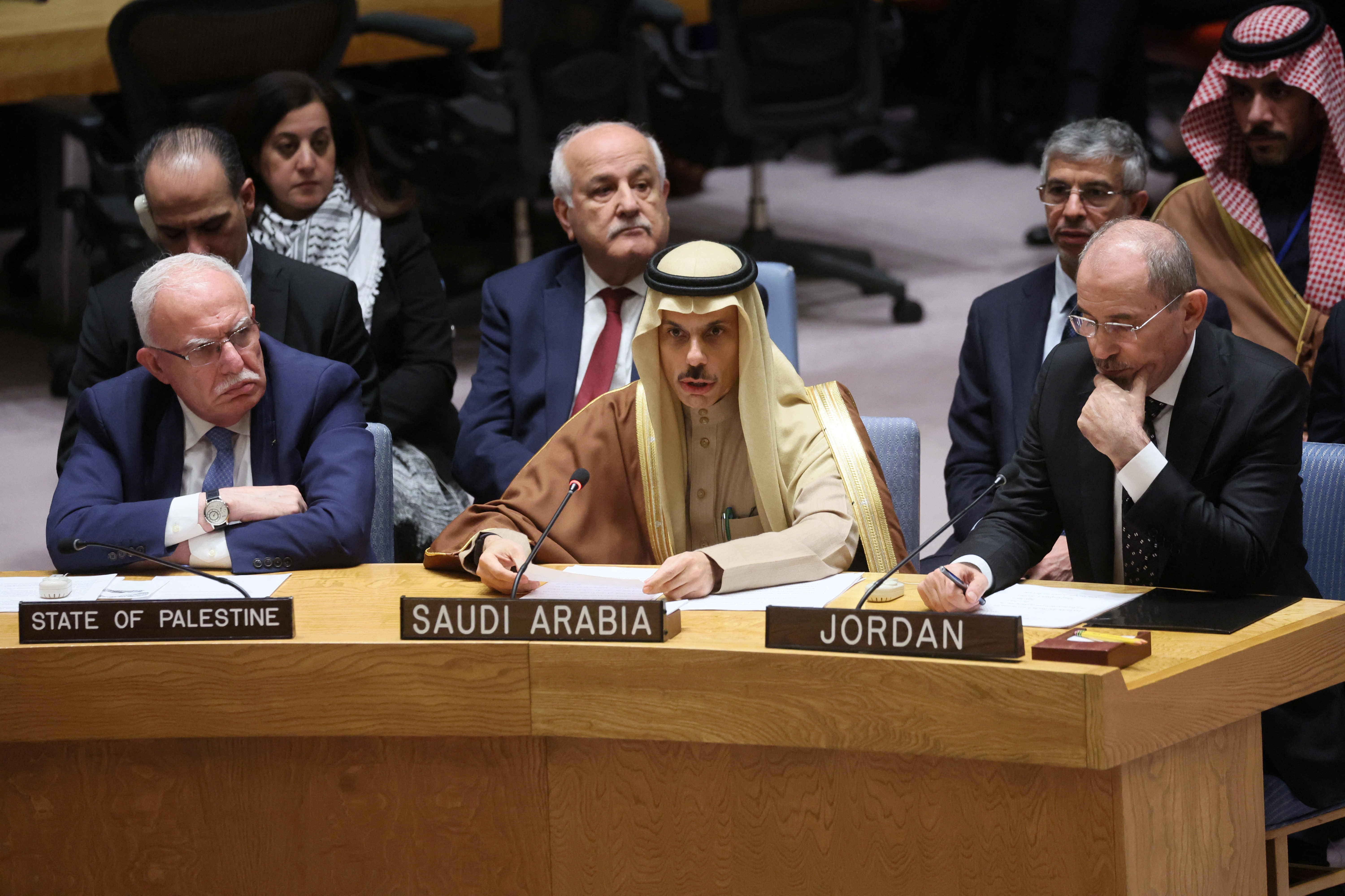 Palestinian Foreign Minister Riyad al-Malki, Saudi Arabia's Foreign Minister Prince Faisal bin Farhan Al Saud and Jordanian Foreign Minister Ayman Safadi attend a UN Security Council meeting on the conflict between Israel and Hamas, in New York City