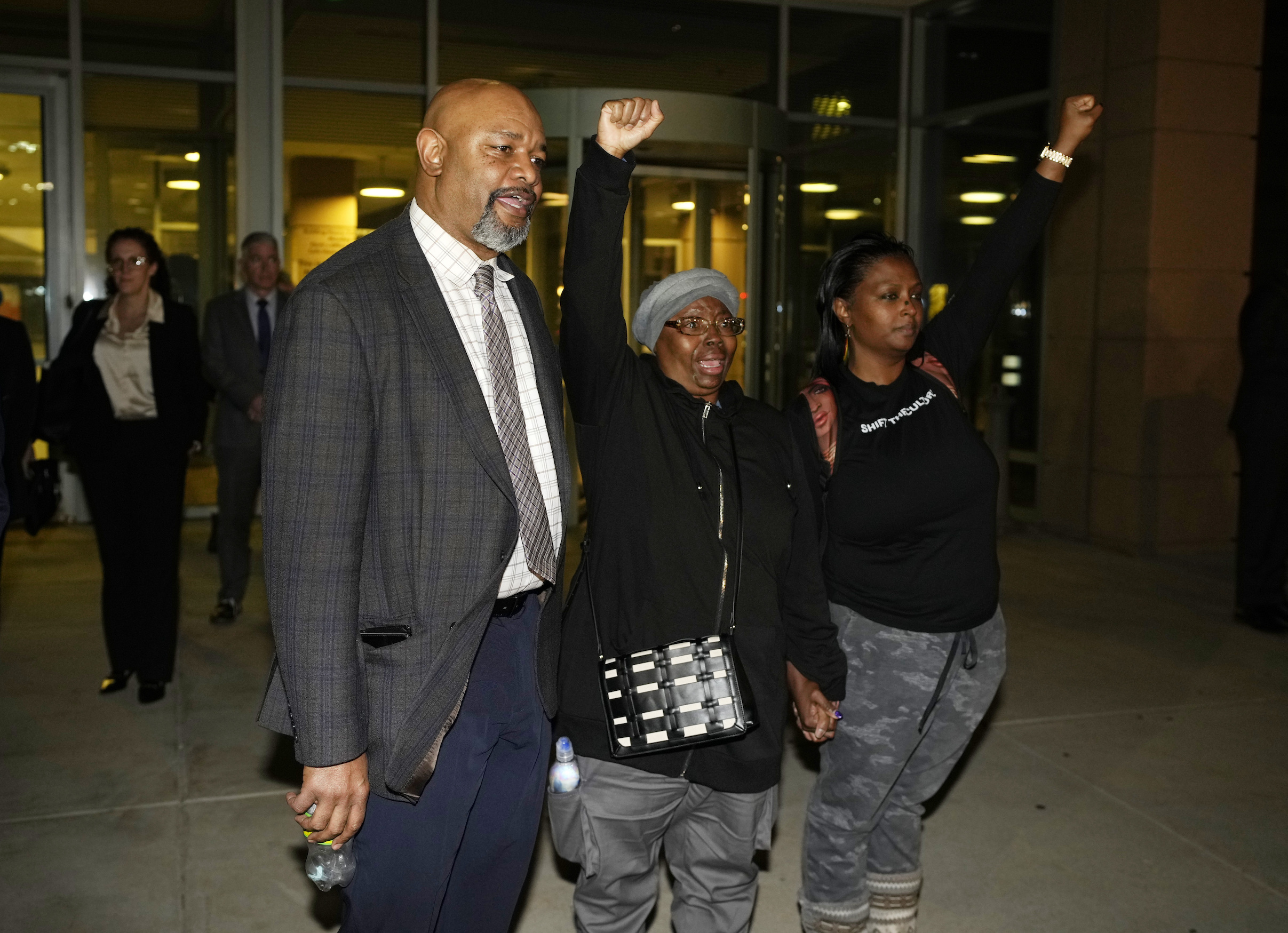 Sheneen McClain, Omar Montgomery, president of the Aurora NAACP, and Midian Holmes outside the Adams County CO Justice Center after verdicts were rendered