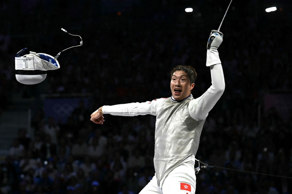 Cheung Ka Long from Hong Kong, China, celebrates after winning against Italy’s Filippo Macchi in the men’s foil individual gold medal bout during the Paris 2024 Olympic Games. PHOTO: FABRICE COFFRINI / AFP