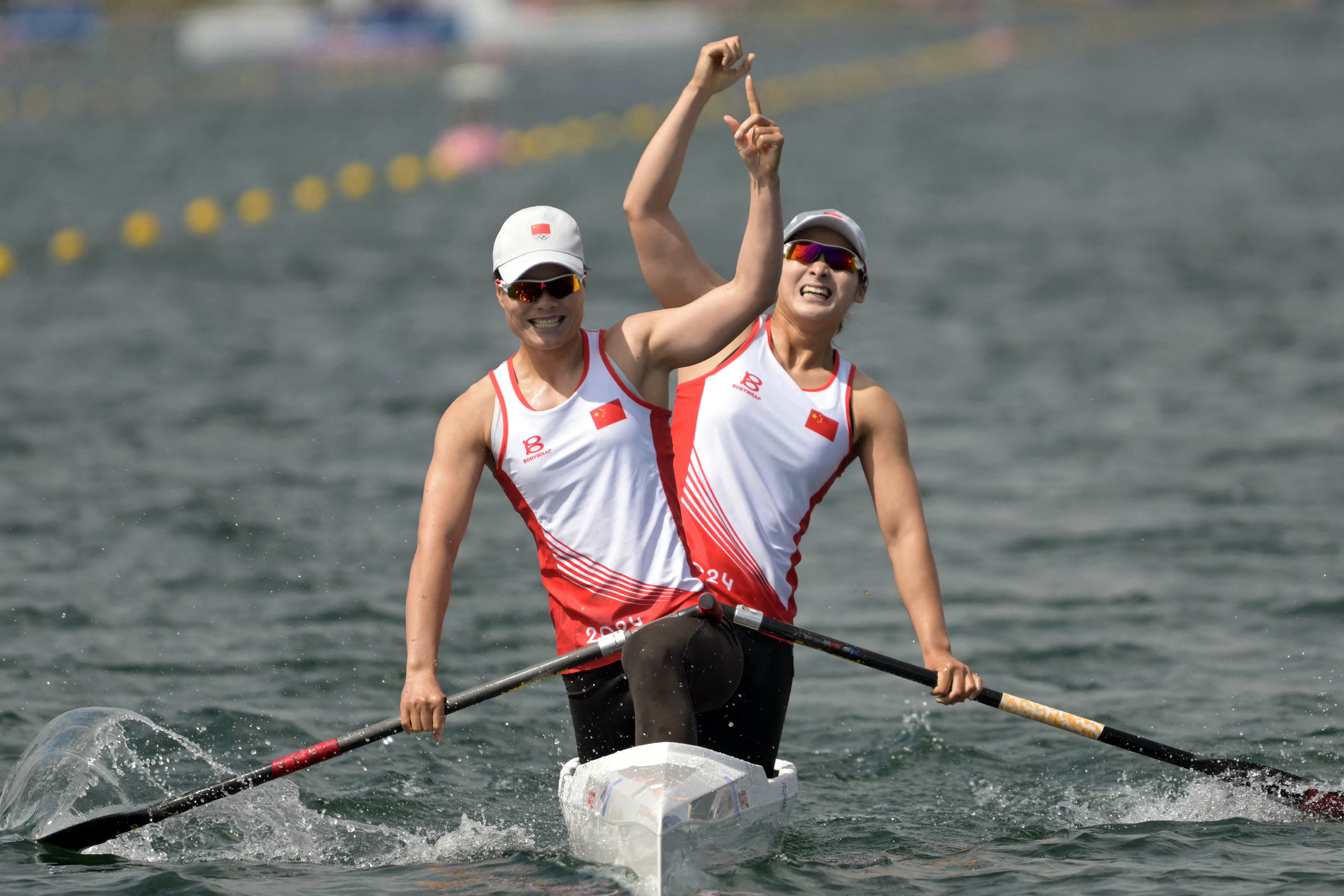 China's gold medallists Xu Shixiao and China's Sun Mengya celebrate winning in the women's canoe double 500m final of the canoe sprint competition at the Paris 2024 Olympic Games on August 9, 2024. Photo: Bertrand GUAY / AFP