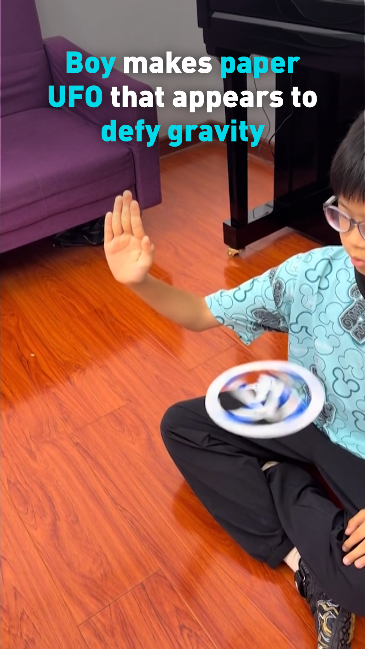 Boy makes paper UFO that appears to defy gravity