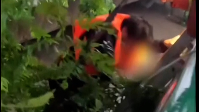 Emergency crew rescues people trapped by flood amid Typhoon Bavi
