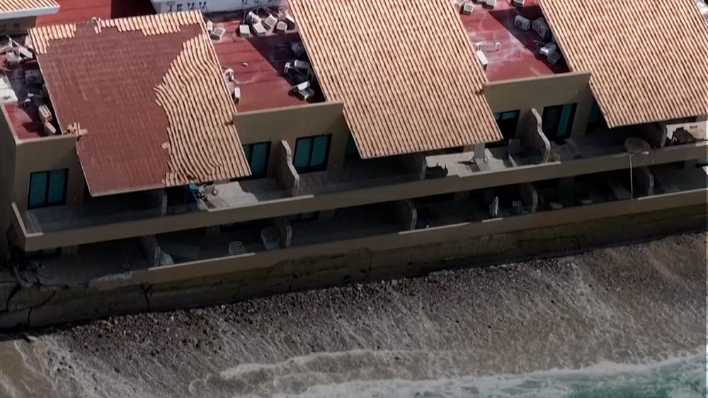 Illegally built beachfront complex tilts toward the sea in Mexico